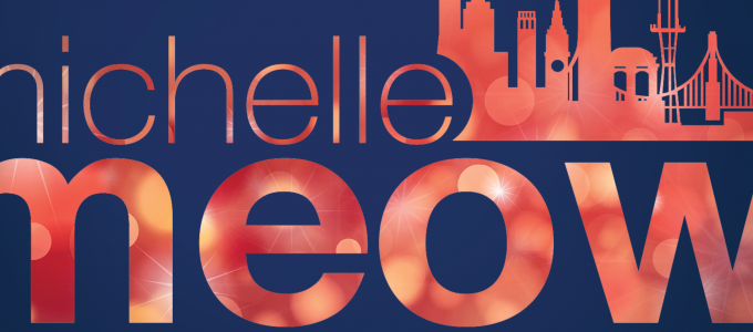Image - Michelle Meow Show logo with holiday bokey lighting behind the letters
